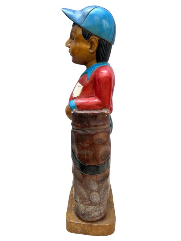 Golfeur en bois sculpté