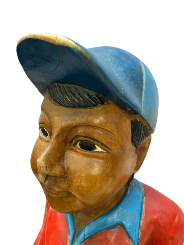 Golfeur en bois sculpté