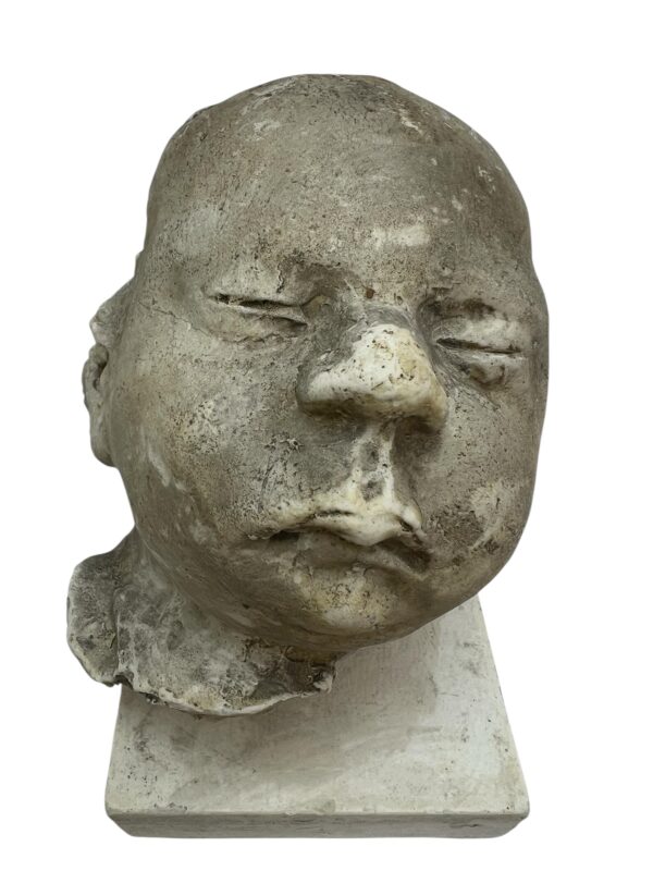 Paire de visages en plâtre, objet de curiosité