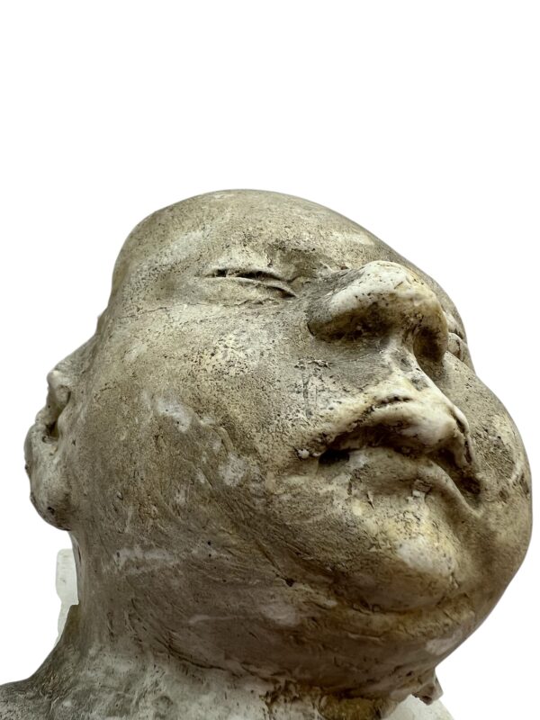 Paire de visages en plâtre, objet de curiosité
