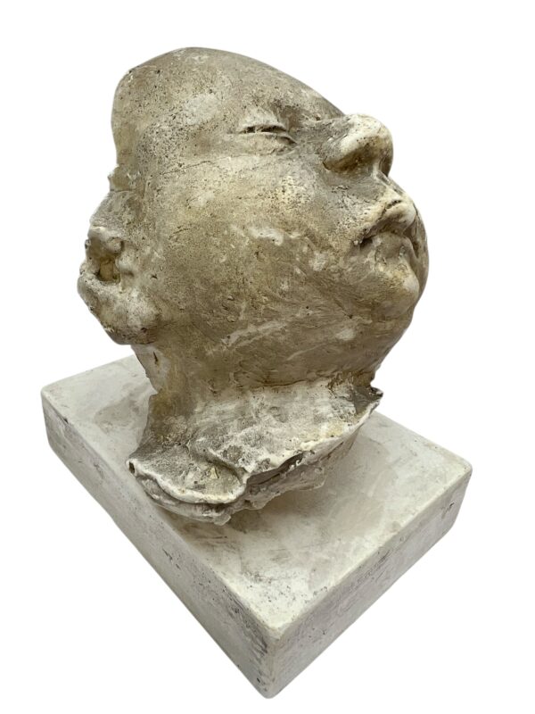 Paire de visages en plâtre, objet de curiosité